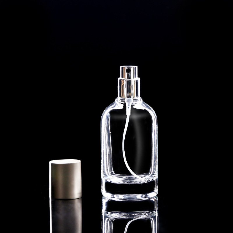 Customized Glass Bottle Cylindrical 50ml 100ml perfume bottle with sprayer silver cap for personal care glass container