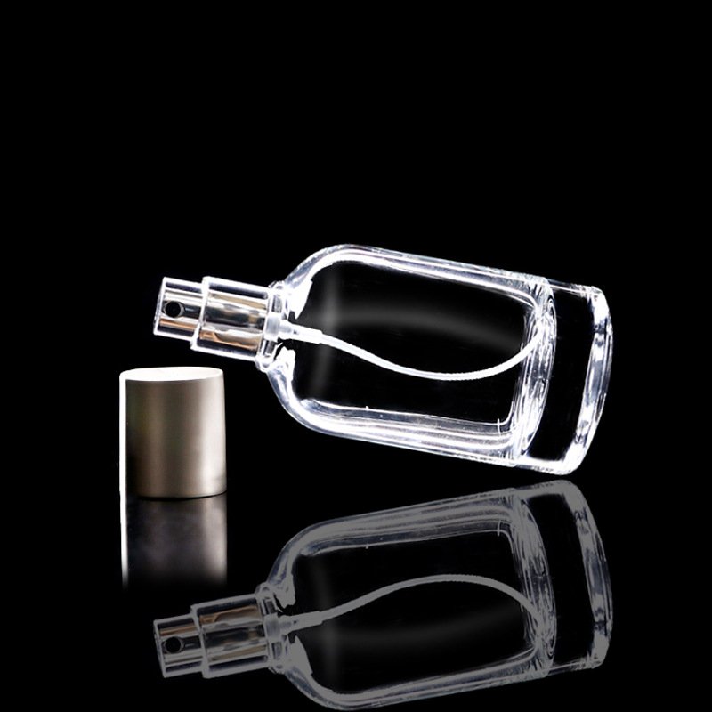 Customized Glass Bottle Cylindrical 50ml 100ml perfume bottle with sprayer silver cap for personal care glass container