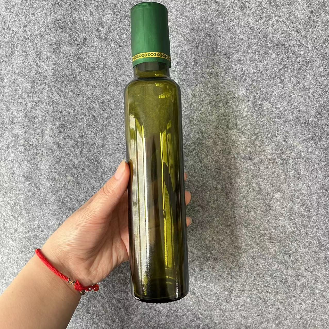 Food grade wholesale custom dark green empty olive oil dispenser bottle glass bottles for olive oil with lid