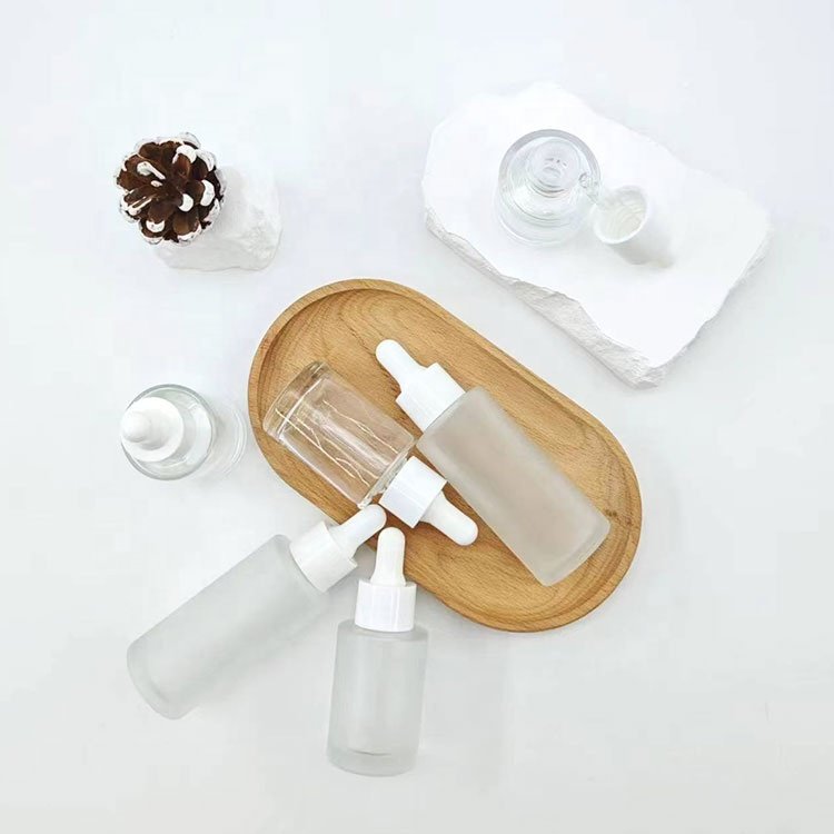 30 ml 15ml 50ml printed elegant white dropper serum bottles stock 50 ml round frosted glass empty bottle with rubber dropper