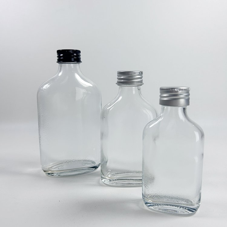 Empty 50Ml 100Ml Glass Bottle Mini Small Sample Thick Transparent Wine Glass Bottle with Screw Black Silver Cap
