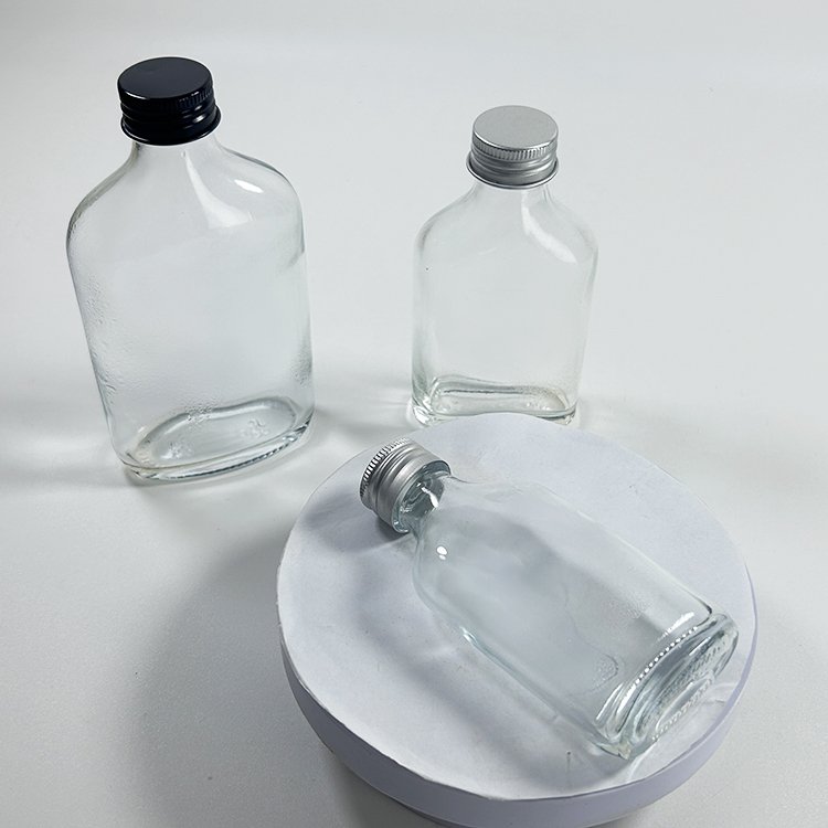 Empty 50Ml 100Ml Glass Bottle Mini Small Sample Thick Transparent Wine Glass Bottle with Screw Black Silver Cap