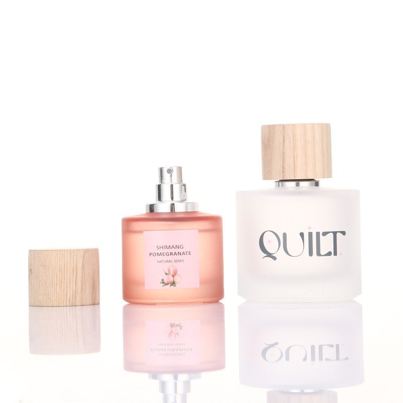 Wholesale 100ml 50ml 30ml Round Frosted Clear Glass Perfume Bottle With Wooden Cap