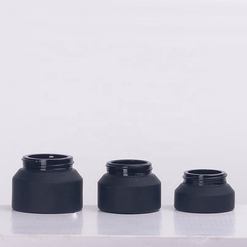 Inclined shoulder matte black glass bottle 30 ml 60 ml 100 ml cosmetic bottle and 15 gm 30 gm 50 gm glass jar with bamboo lid