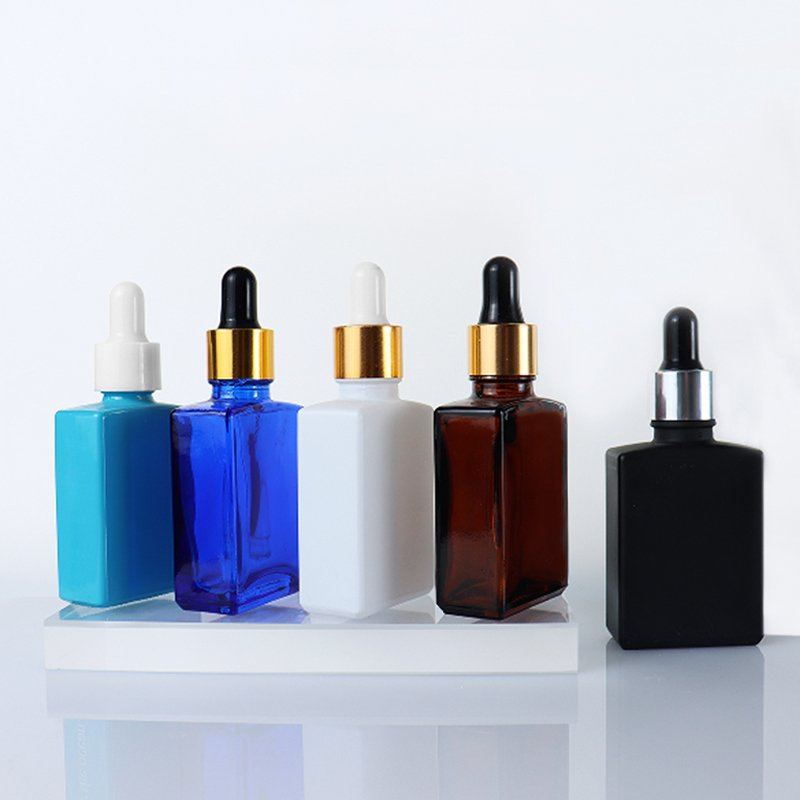 Custom 1 oz rectangular square clear amber essential oil serum bottles 30ml 50ml 100ml black glass dropper bottle with box