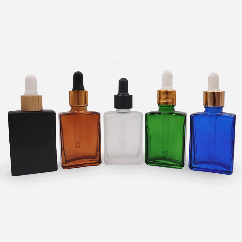 Custom 1 oz rectangular square clear amber essential oil serum bottles 30ml 50ml 100ml black glass dropper bottle with box