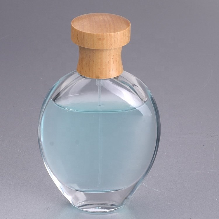 Customized 100ml glass perfume bottle luxury clear spray glass bottle glass perfume bottles with Sprayer wooden lids cap