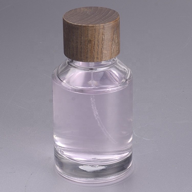 Customized 100ml glass perfume bottle luxury clear spray glass bottle glass perfume bottles with Sprayer wooden lids cap