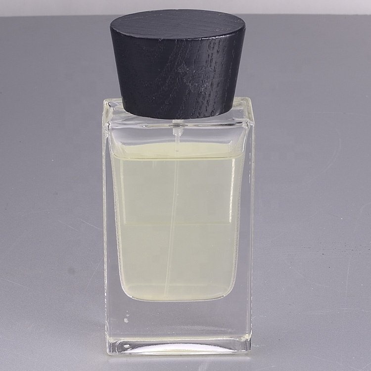 Customized 100ml glass perfume bottle luxury clear spray glass bottle glass perfume bottles with Sprayer wooden lids cap