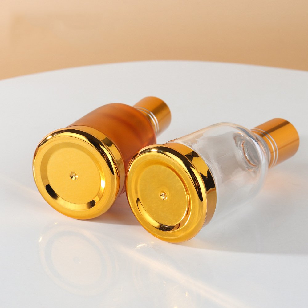 Luxury 20ml 30ml 50ml round clear amber roll on glass bottle with metal glass roller gloden cap bottle for perfume essential oil