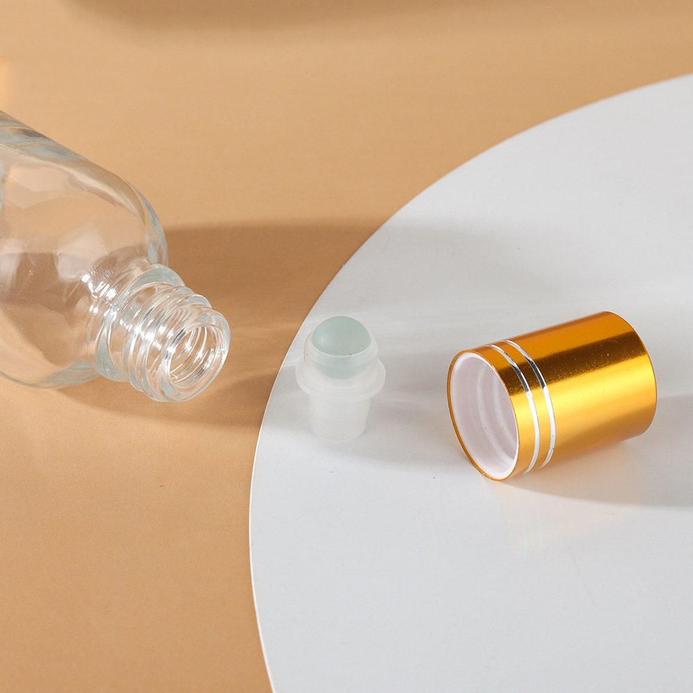 Luxury 20ml 30ml 50ml round clear amber roll on glass bottle with metal glass roller gloden cap bottle for perfume essential oil