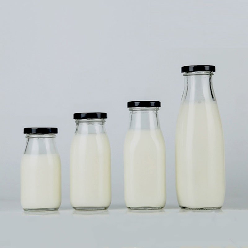 Wholesale sale transparent twist off lids glass milk bottles of various sizes 100ml 200ml 250ml 500ml 1L