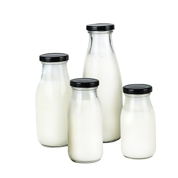 Wholesale sale transparent twist off lids glass milk bottles of various sizes 100ml 200ml 250ml 500ml 1L