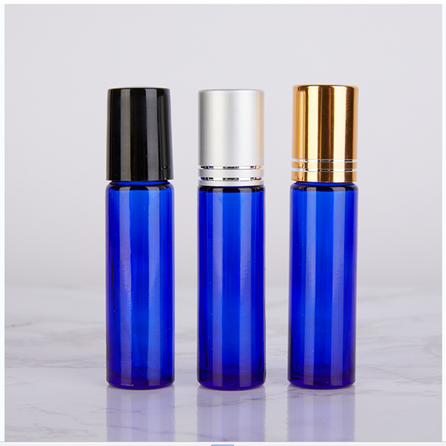 empty blue 10ml glass roller ball bottles for essential oils And the gold, silver, black and white lid