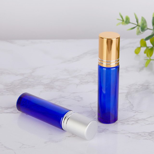 empty blue 10ml glass roller ball bottles for essential oils And the gold, silver, black and white lid
