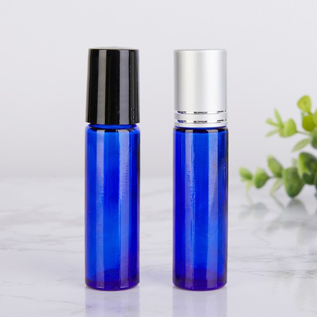 empty blue 10ml glass roller ball bottles for essential oils And the gold, silver, black and white lid