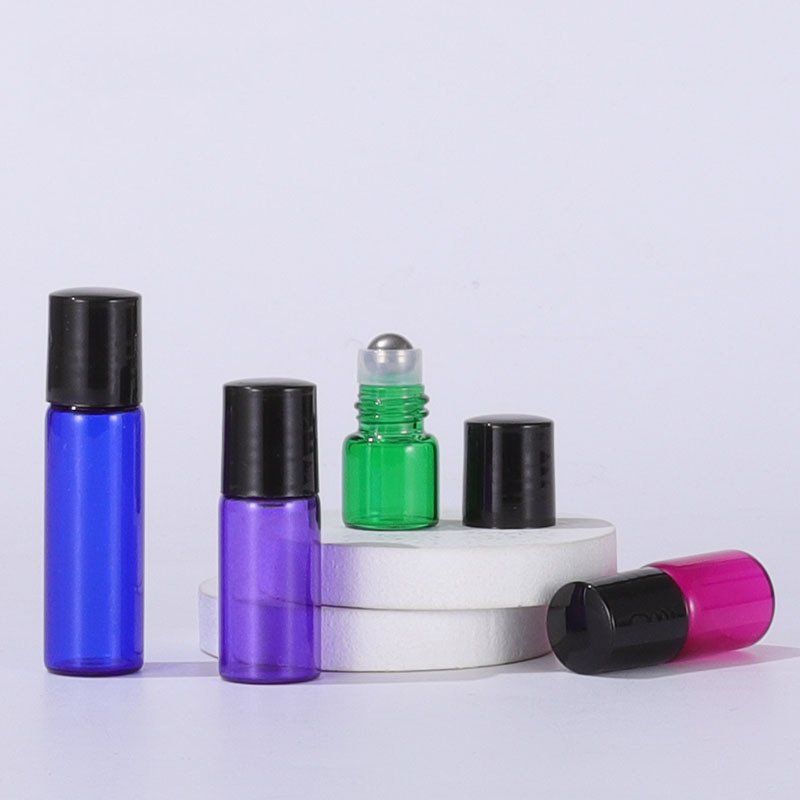 Wholesale essential oil perfume roller bottle clear amber blue pink purple green 1ml 2ml 3ml 5ml glass roll on bottle with cap