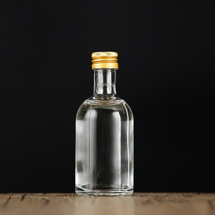 50ml100ml empty clear round liquor small sample glass bottle with metal lid
