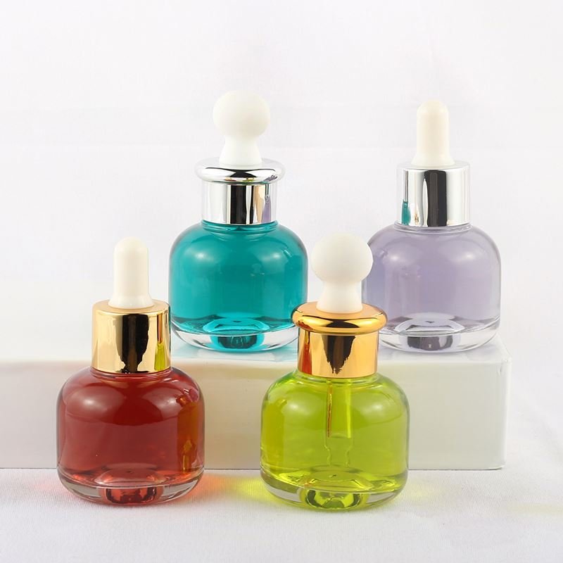 Cheap wholesale cylindrical transparent skin care essence bottle 30ml glass dropper bottle