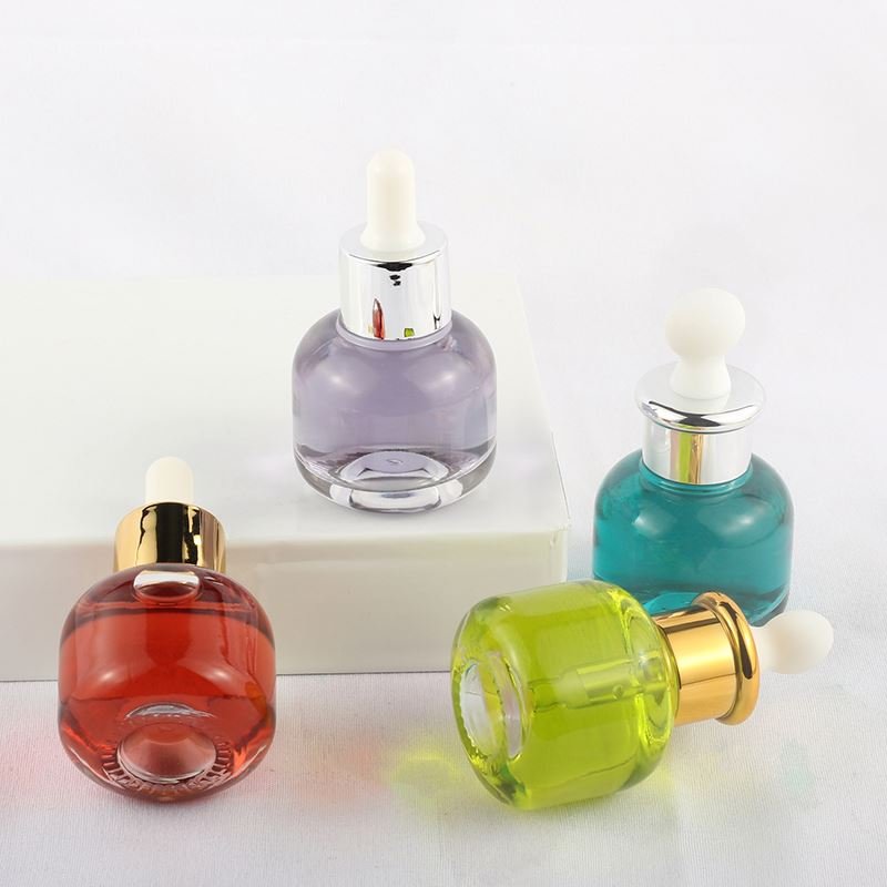 Cheap wholesale cylindrical transparent skin care essence bottle 30ml glass dropper bottle