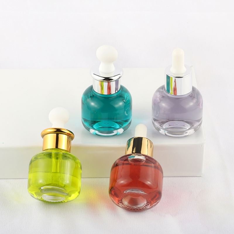 Cheap wholesale cylindrical transparent skin care essence bottle 30ml glass dropper bottle