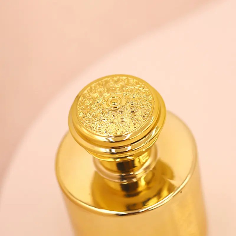 Factory direct wholesale High quality 100ml Luxury Newest Design Golden Luxury Round Glass Perfume Bottle with Screw Cap