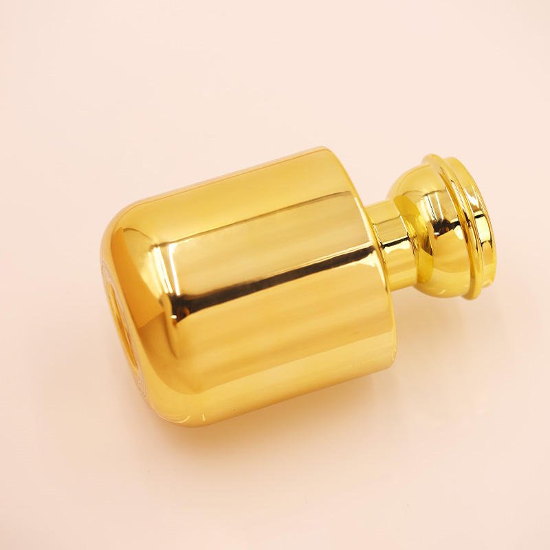 Factory direct wholesale High quality 100ml Luxury Newest Design Golden Luxury Round Glass Perfume Bottle with Screw Cap