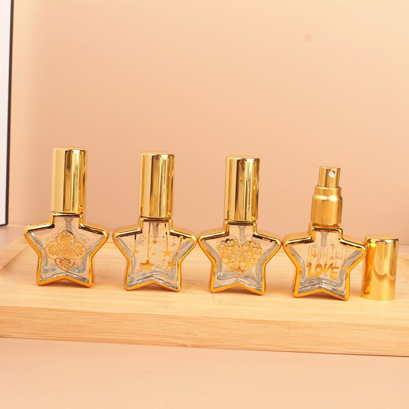 Empty fancy 8ml star shape gold stamping clear glass spray bottle perfume sample bottle with gold spray cap