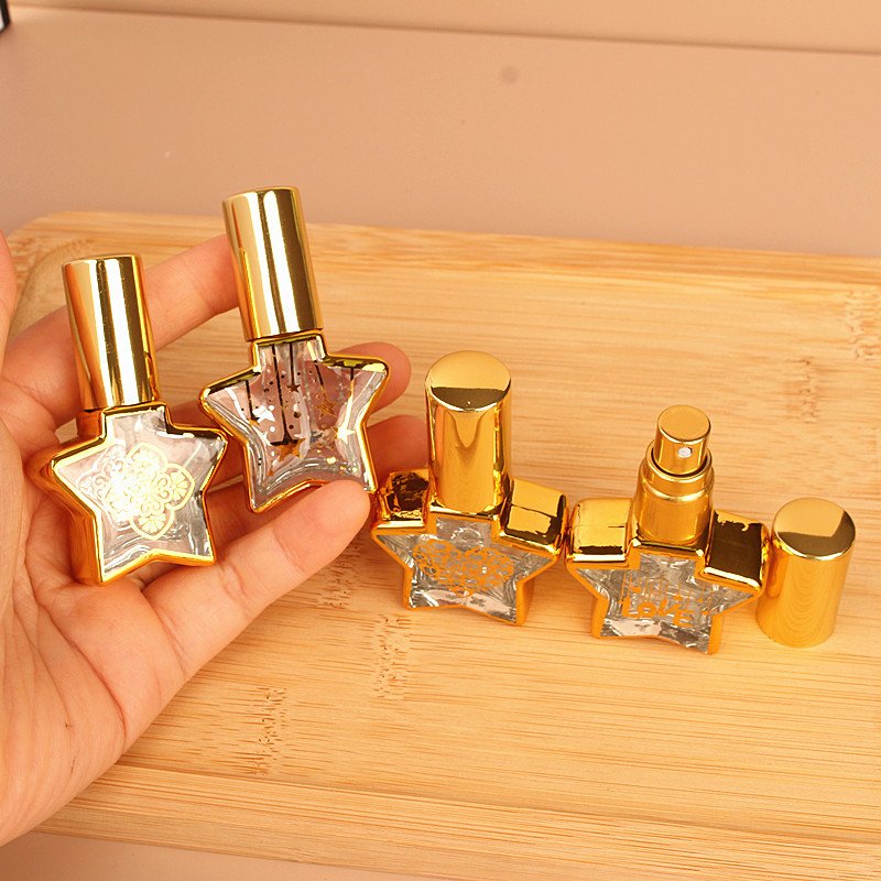 Empty fancy 8ml star shape gold stamping clear glass spray bottle perfume sample bottle with gold spray cap