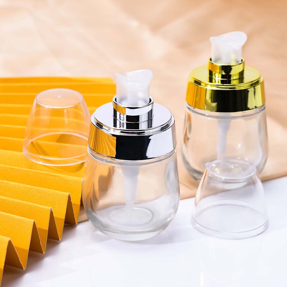 Customized Luxury cosmetic 30ml 50ml clear glass serum lotion bottle with pump lids