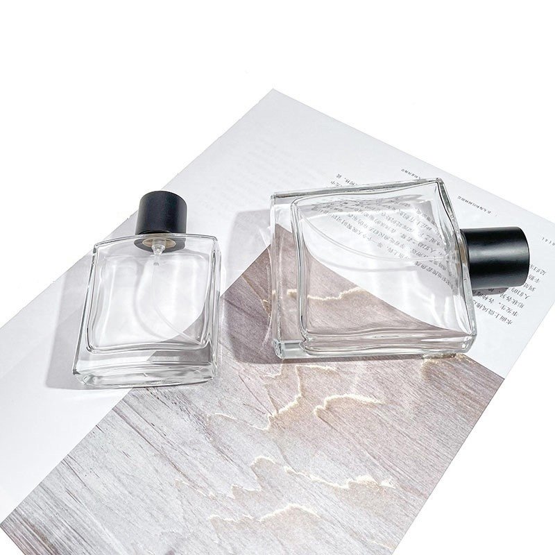 Wholesale 50ml 100ml Luxury Flat Square Glass Perfume Glass Bottle With Sprayer And Lid