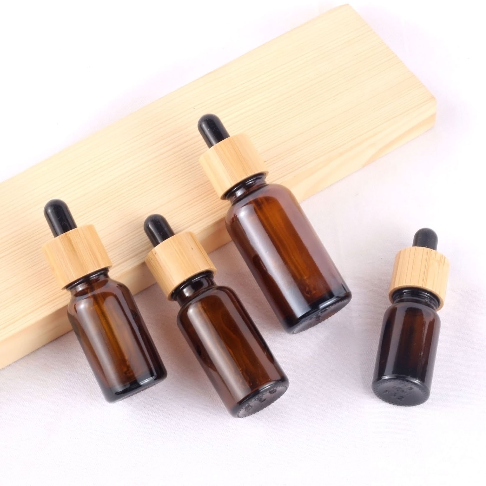 Factory Original Stock Price Cosmetic Packaging 30 Ml Essential Oil Bamboo Cap Dropper Glass Bottles