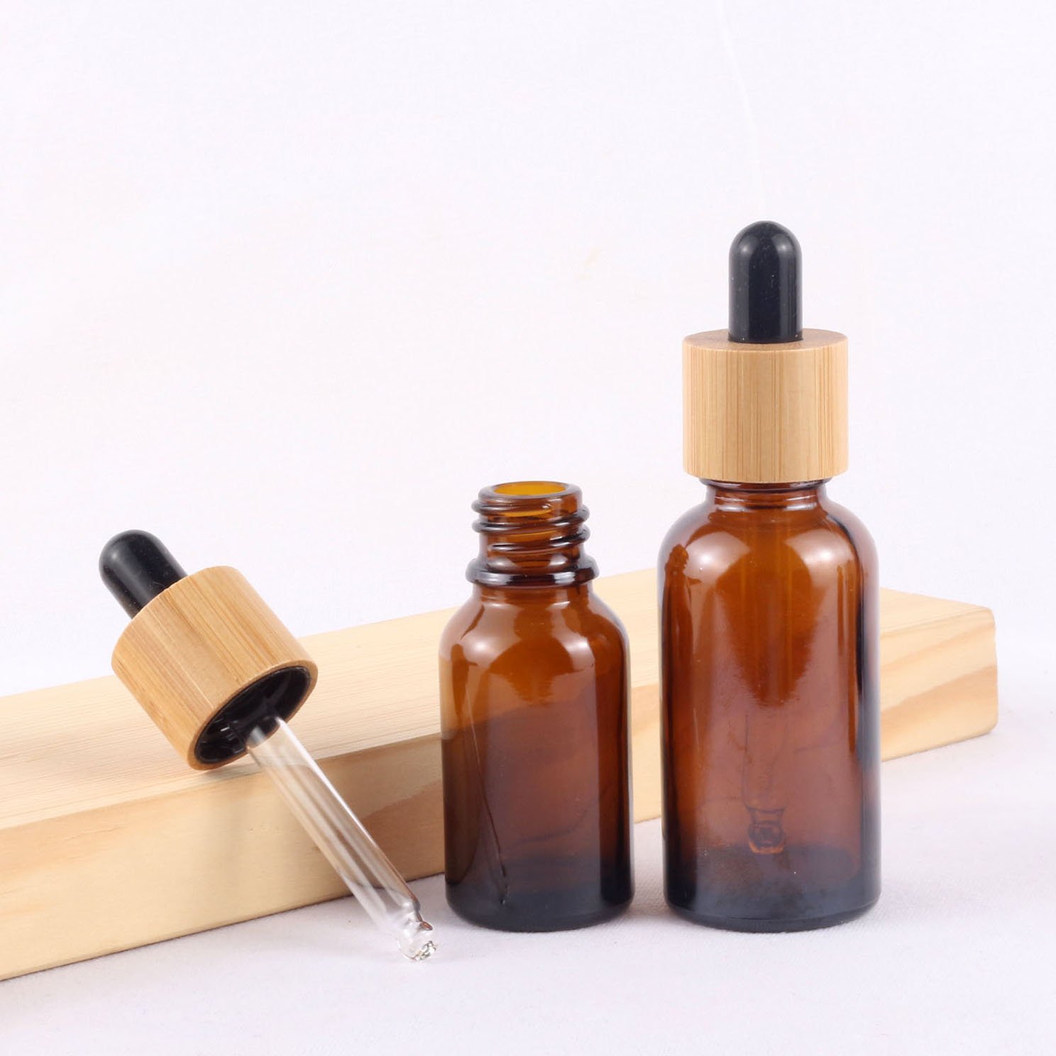 Factory Original Stock Price Cosmetic Packaging 30 Ml Essential Oil Bamboo Cap Dropper Glass Bottles