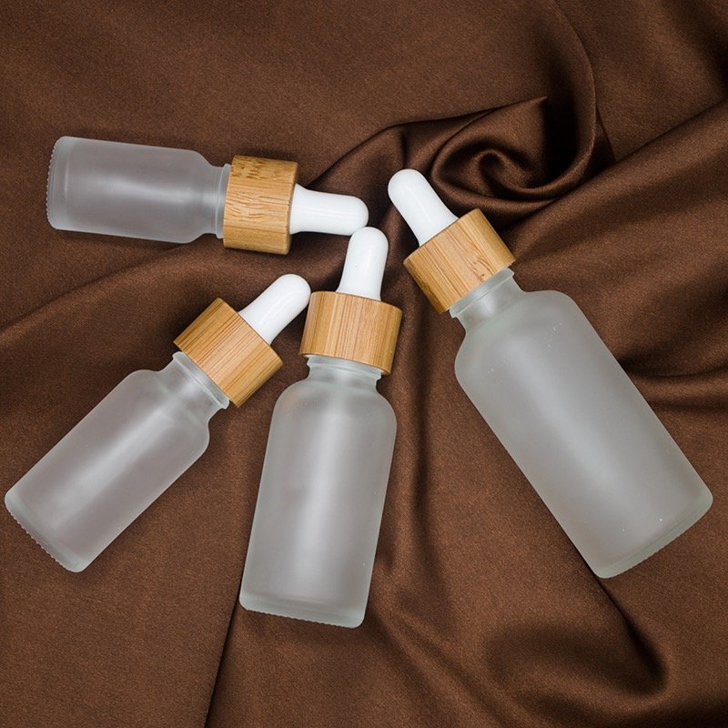 10ml 20ml 30ml 50ml 100ml 1oz Empty Essential Oil Glass Bottle 50ml Transparent Frosted Bamboo Cap Dropper Glass Bottle