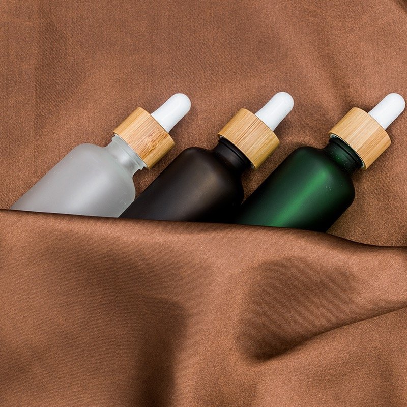 10ml 20ml 30ml 50ml 100ml 1oz Empty Essential Oil Glass Bottle 50ml Transparent Frosted Bamboo Cap Dropper Glass Bottle