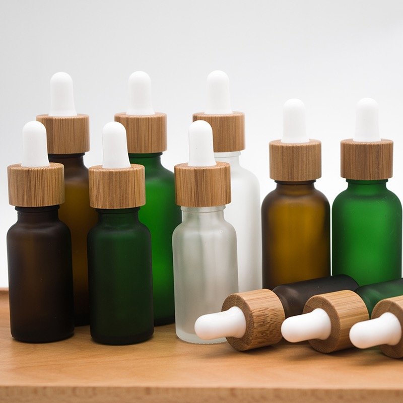 10ml 20ml 30ml 50ml 100ml 1oz Empty Essential Oil Glass Bottle 50ml Transparent Frosted Bamboo Cap Dropper Glass Bottle