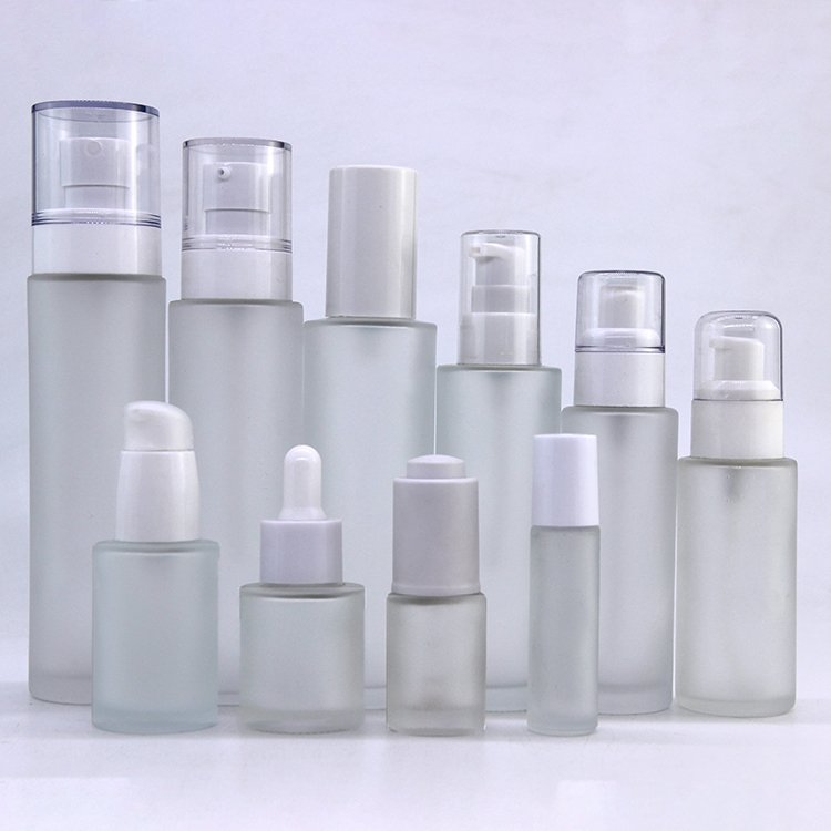 Supply wholesale empty frosted glass lotion bottle for skin care 30ml 100ml cosmetic pump glass spray bottle manufacturers