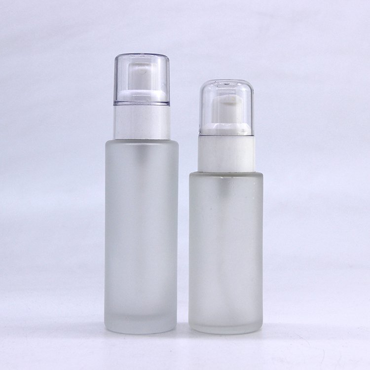 Supply wholesale empty frosted glass lotion bottle for skin care 30ml 100ml cosmetic pump glass spray bottle manufacturers