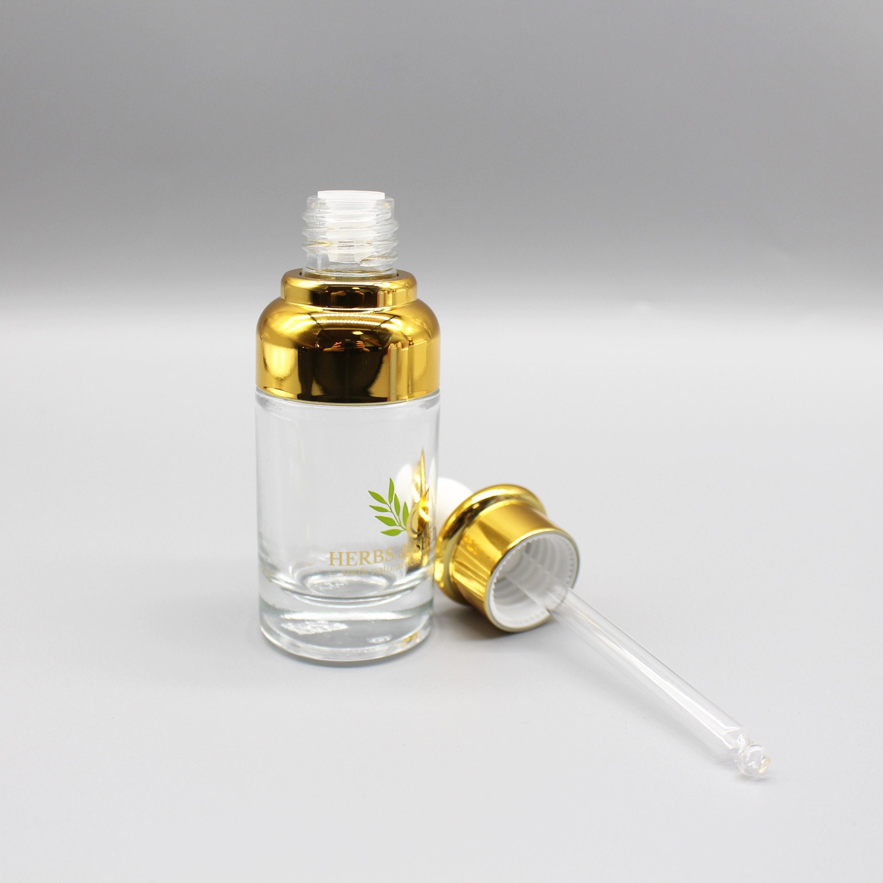 Top grade cosmetics 30ml essence stock bottle cover shoulder dropper essential oil glass bottle with paper box