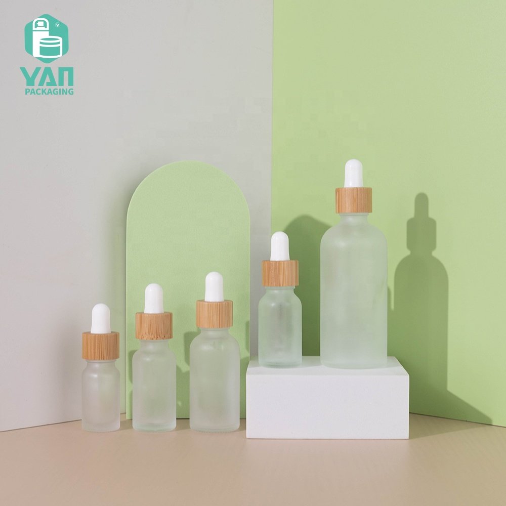 YAN Packaging 10ml 15ml 20ml 30ml 100ml clear frosted bamboo dropper essential oil cosmetics glass oil bottle wholesale