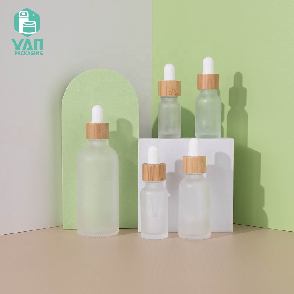 YAN Packaging 10ml 15ml 20ml 30ml 100ml clear frosted bamboo dropper essential oil cosmetics glass oil bottle wholesale