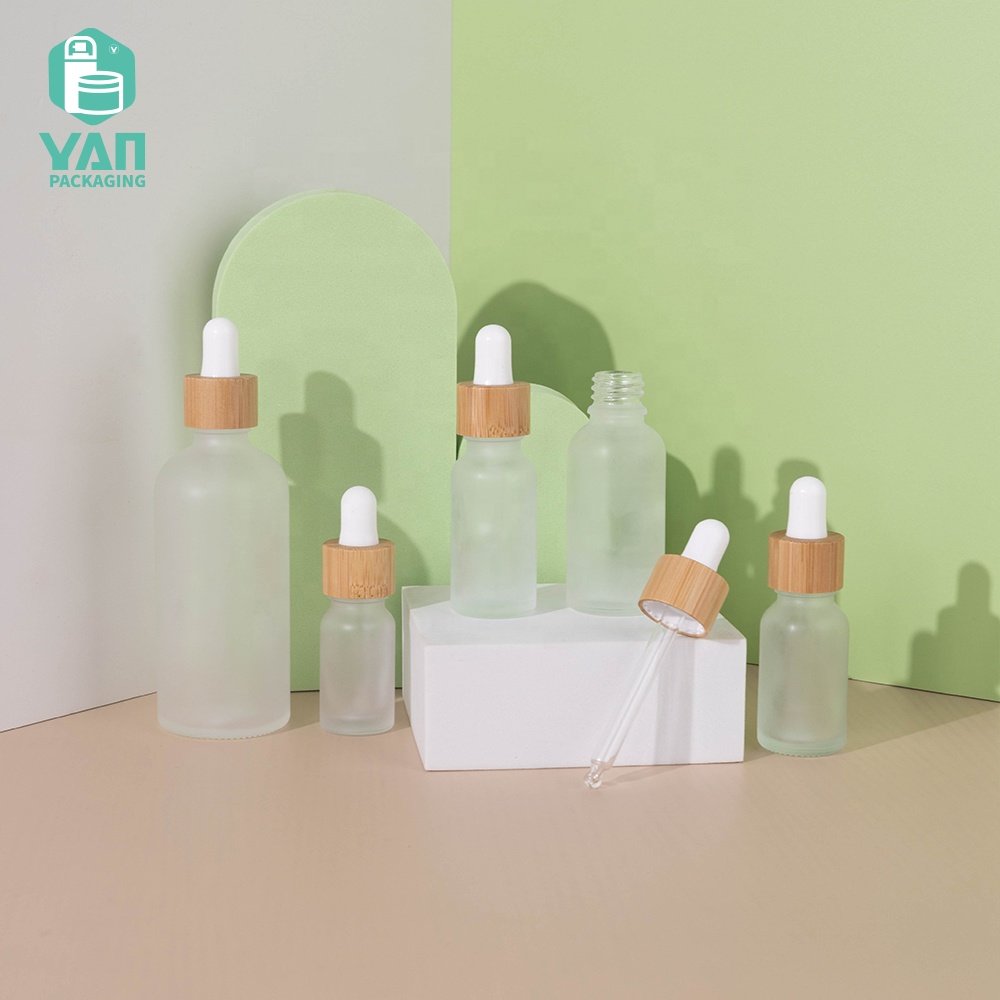 YAN Packaging 10ml 15ml 20ml 30ml 100ml clear frosted bamboo dropper essential oil cosmetics glass oil bottle wholesale
