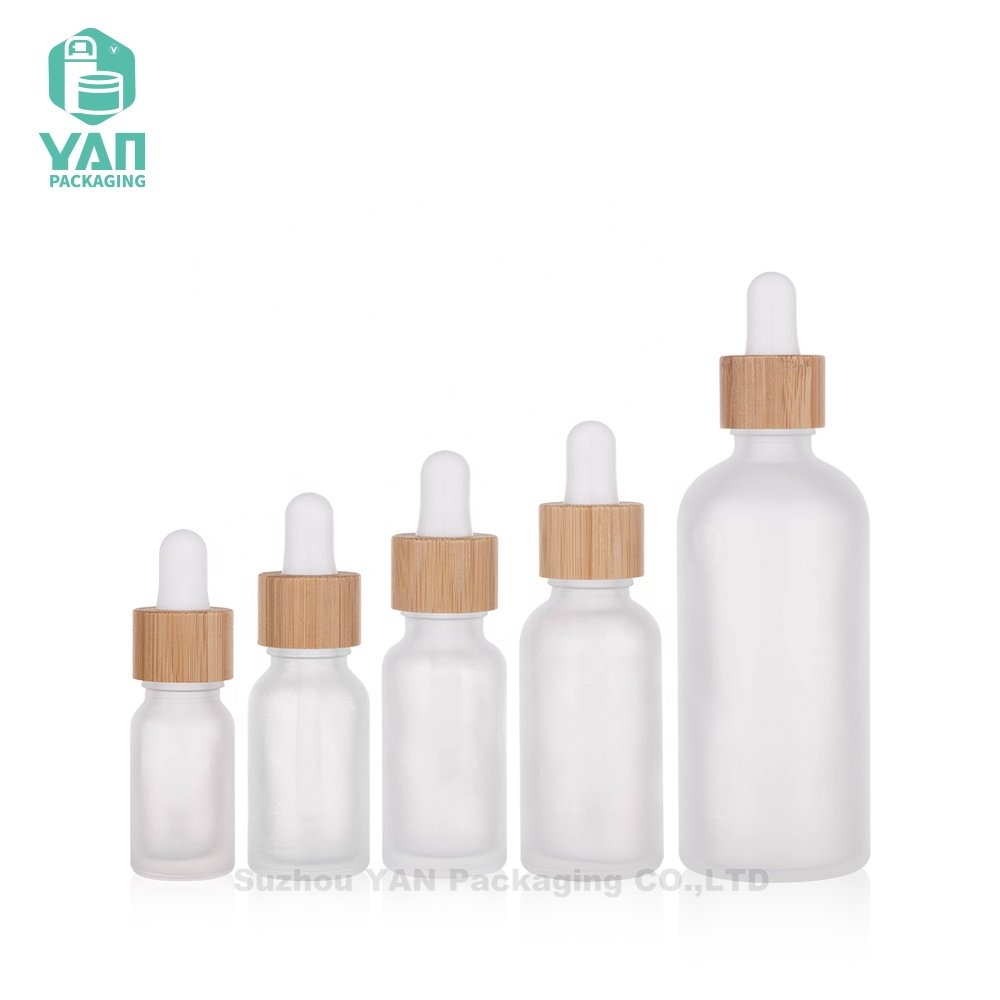YAN Packaging 10ml 15ml 20ml 30ml 100ml clear frosted bamboo dropper essential oil cosmetics glass oil bottle wholesale