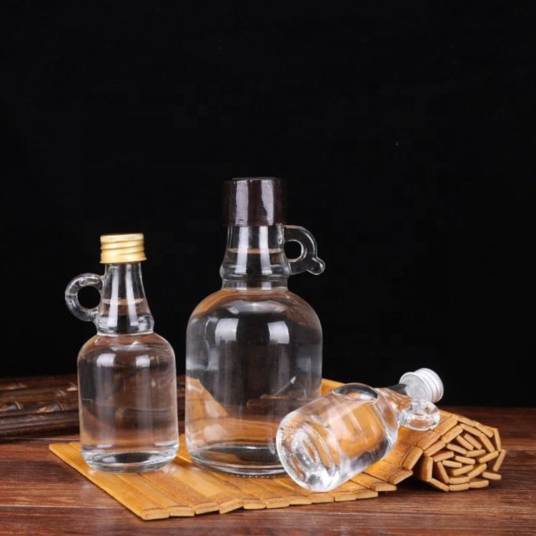 ONO Factory Price 50ml 100ml 250ml Empty Clear Small Mini California Glass Bottles With Handle For Maple Syrup