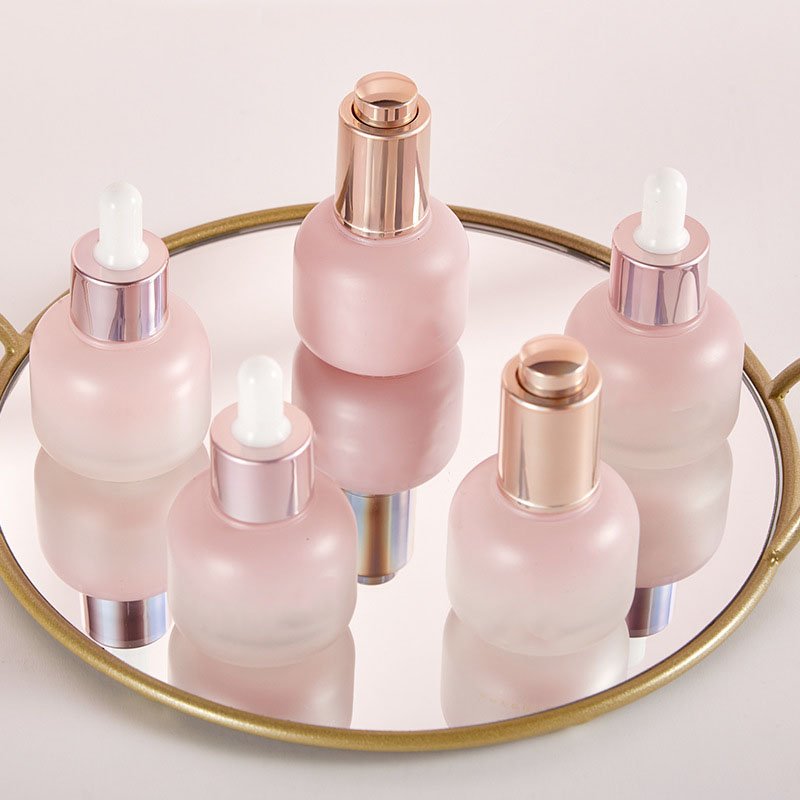 Custom logo glass Refined oil bottle 30ml cosmetics frosted cylindrical bottle pressure pump dropper glass bottle process