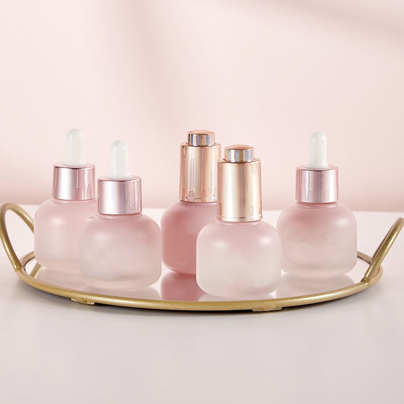 Custom logo glass Refined oil bottle 30ml cosmetics frosted cylindrical bottle pressure pump dropper glass bottle process