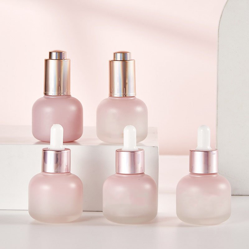 Custom logo glass Refined oil bottle 30ml cosmetics frosted cylindrical bottle pressure pump dropper glass bottle process