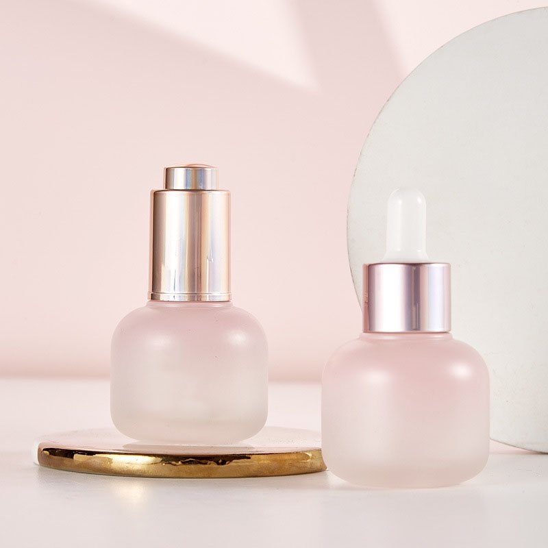 Custom logo glass Refined oil bottle 30ml cosmetics frosted cylindrical bottle pressure pump dropper glass bottle process
