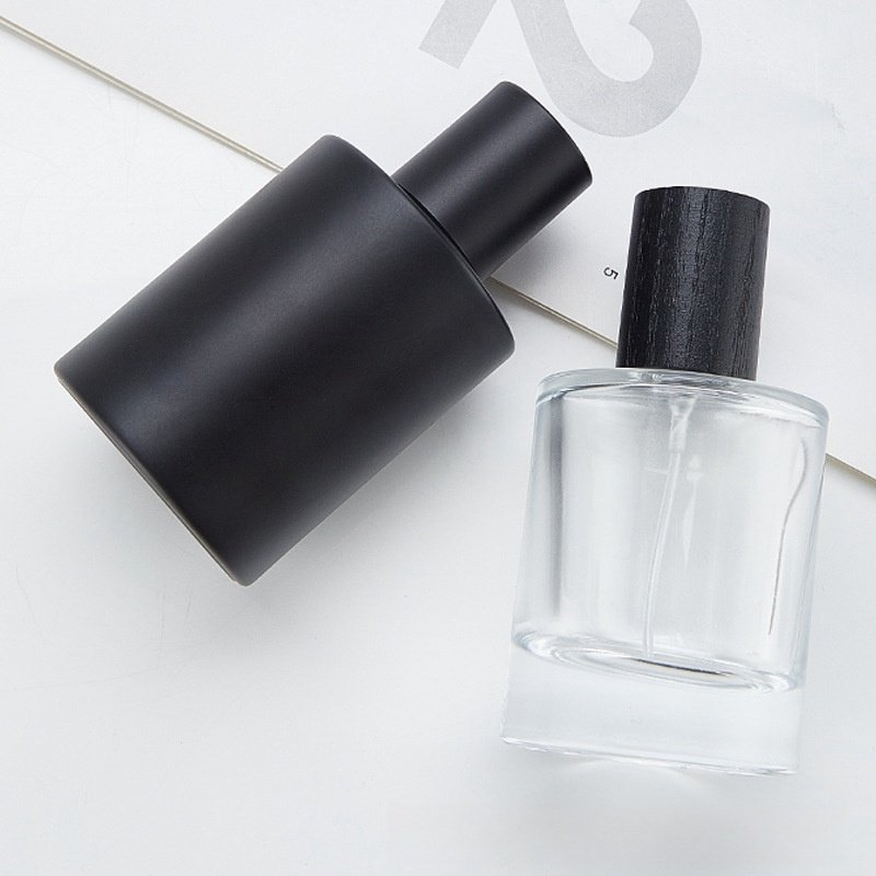 Wholesale Matte Black Glass Perfume Bottle 50ml Round Perfume Glass Bottle With Black Cap