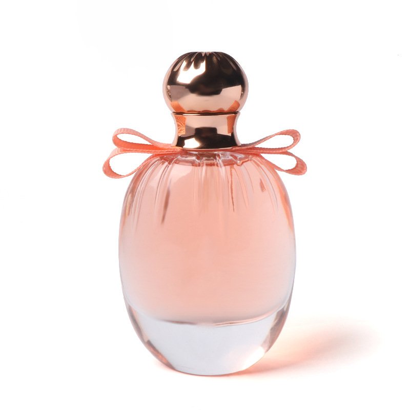 Hot selling round transparent golden cap pink bowknot luxury customized 100ml perfume glass spray bottle with lid